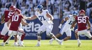 Blake Freeland #71 of the Brigham Young Cougars blocks against the Arkansas Razorbacks